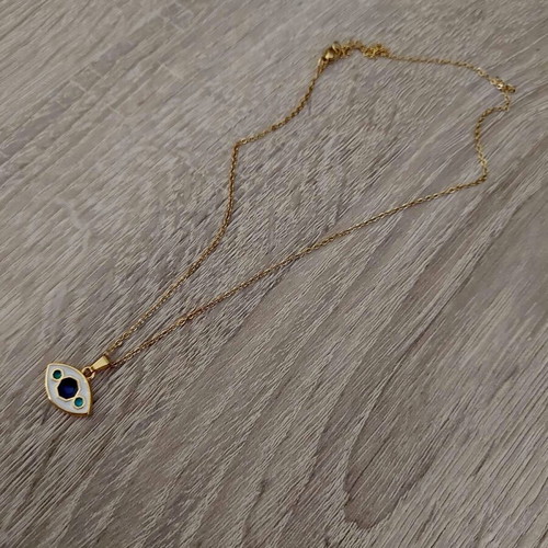 Women's steel evil eye pendant like new, white and gold