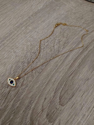 Women's steel evil eye pendant like new, white and gold
