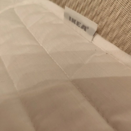IKEA crib mattress pad used with stain