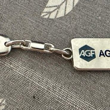 AGF KOSMOS vintage metal keychain