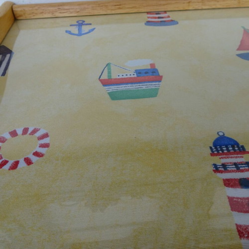 Vintage wooden breakfast tray with nautical theme used
