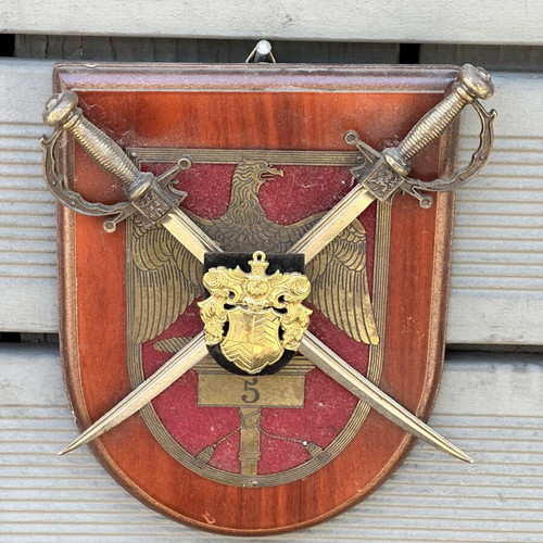 Military crest with crossed swords and eagle on wooden base used