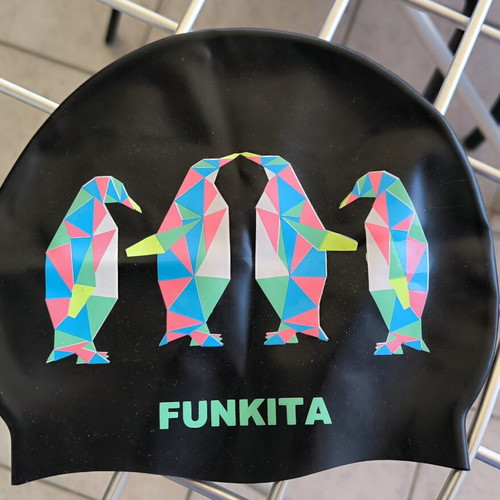 Three branded swimming caps