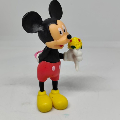 Collectible Mickey Mouse figure like new with bouquet