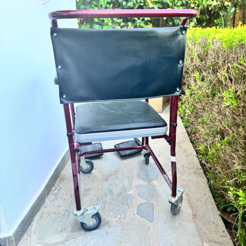 Red toilet wheelchair like new, missing container