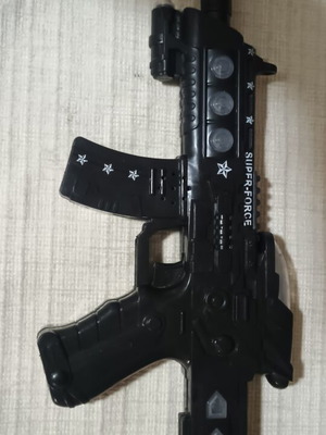 Plastic toy gun like new with sound, light, and speech