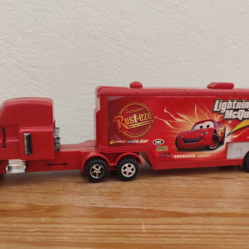 Toy Trucks pack of 3 used, including Cars-themed red truck