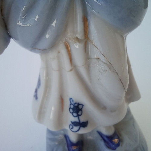 Porcelain figurine used with peasant girl