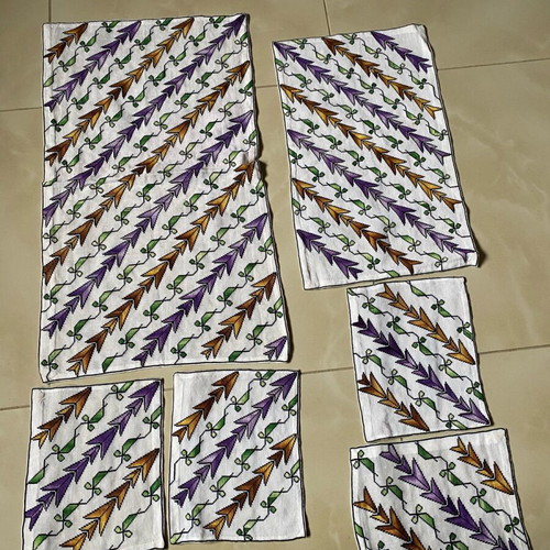 Set of handmade embroidered table linens used, counted pieces
