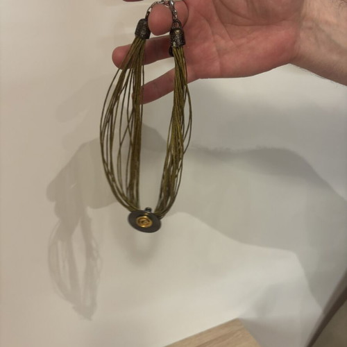 Handmade olive multi-strand necklace with metal decorative element