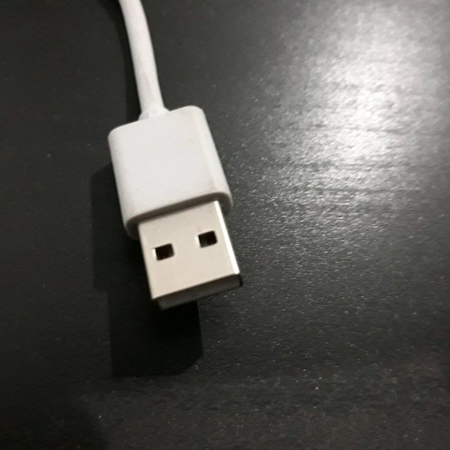USB charger cable used, white color