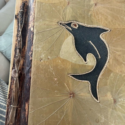 Photo album used with recycled paper, wood and natural leaf