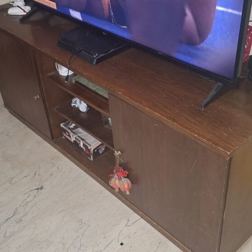 TV stand used with two closed cabinets