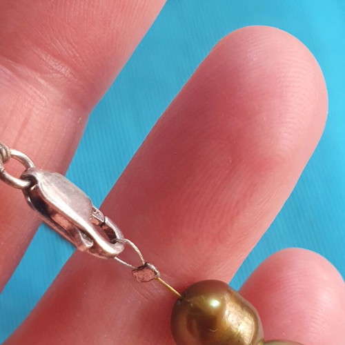 Necklace with natural pearls like new, khaki color, silver clasp