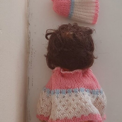 Vintage plastic baby doll from the 70s used with handmade sweater and hat