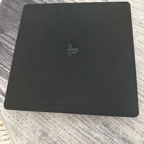 PlayStation 4 Slim 1TB console used with original Sony controller