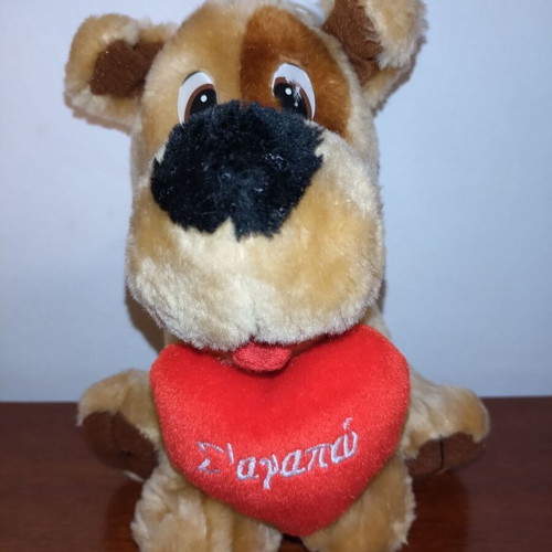 Plush dog used with red heart