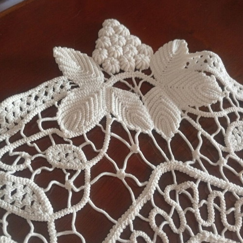 Antique handmade crochet table linen with grape cluster design used