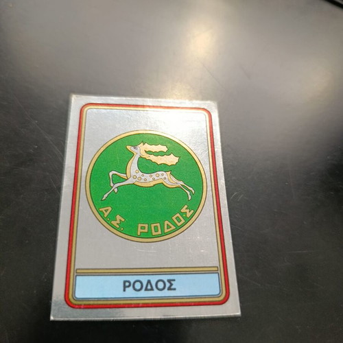 Panini football 82 sticker #328 Rhodes badge
