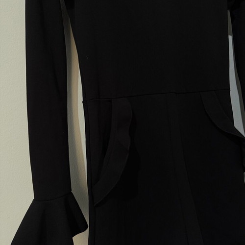 Zara one-piece shortsuit used, black with ruffles and open back