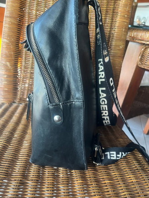 Backpack made of high-quality faux leather used, black with silver details