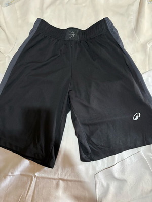 Black athletic shorts, size M