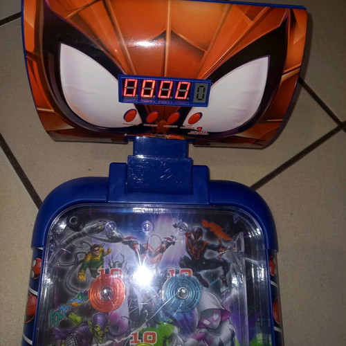Electronic tabletop pinball used with digital scoring and sound effects