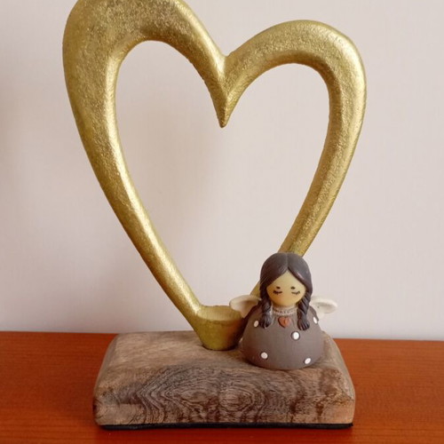 Decorative heart-shaped ornament with angel like new