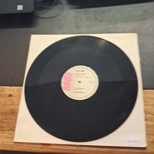 Vinyl record used without cover in excellent condition