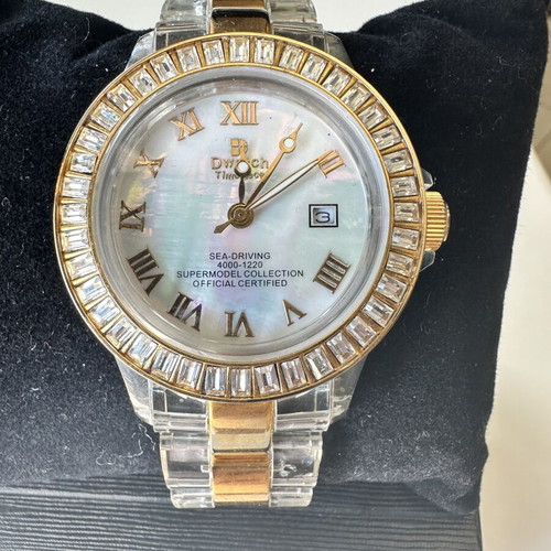 Watch with iridescent crystals like new, zircon and gold