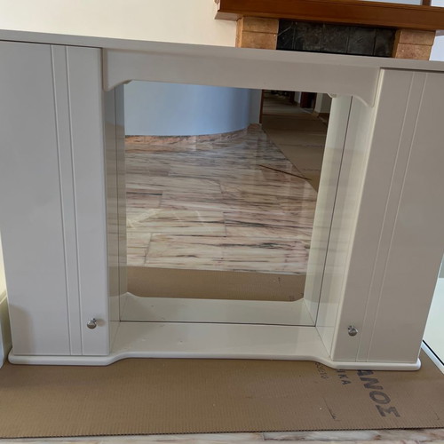 Mirror with storage space used