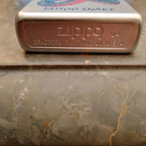 Zippo lighter used with snake design