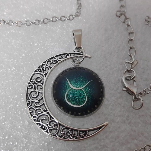 Pendant necklace with Taurus zodiac and crescent moon, like new