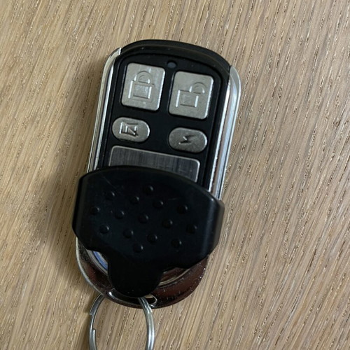 Remote control with cover for garage doors and gates