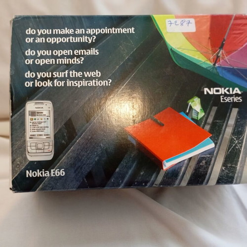 Nokia E66 retro slider phone used with original accessories