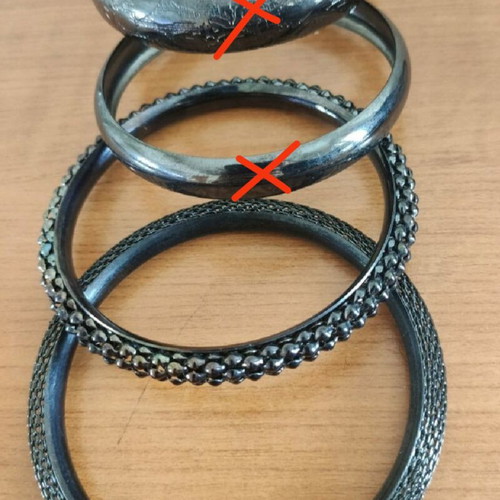 Stacking bangle bracelets used, 7 black metal and 2 colored