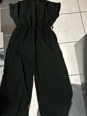 One-piece jumpsuit used, women's black with buttons and elastic waist