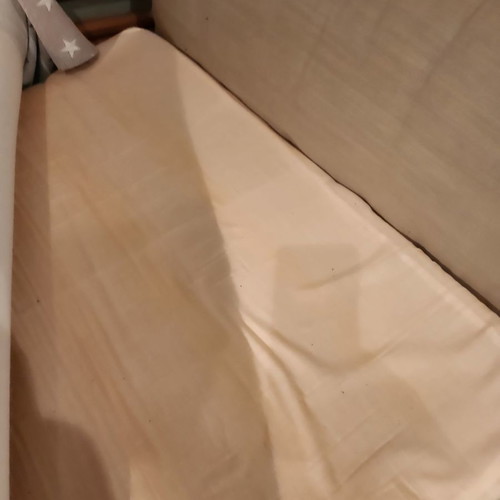 Electric hospital bed used with headboard