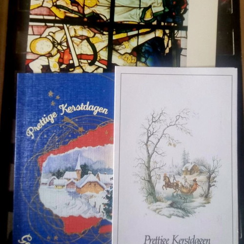 Vintage festive album with 80 cards like new