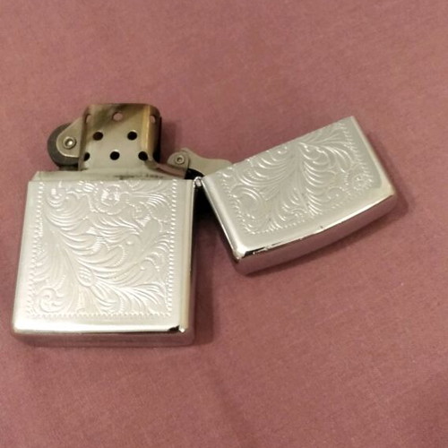 Zippo lighter collectible like new, silver with engravings