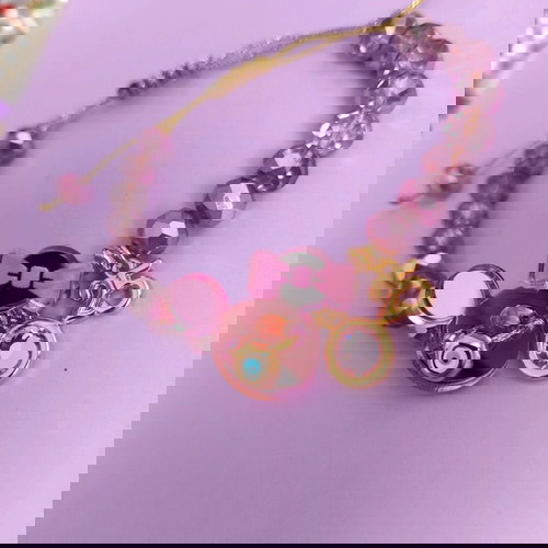 Minnie βραχιόλι λιλά/ροζ/χρυσό like new με ματάκι και ροζ πέτρα