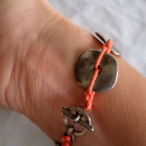 Handmade bracelet with orange cord