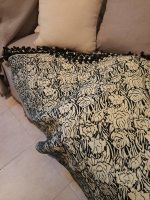 Woven throw new in ecru and black with handmade finishes