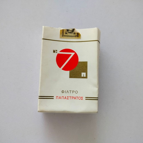 Empty No7 Papastratos cigarette pack used, soft pack