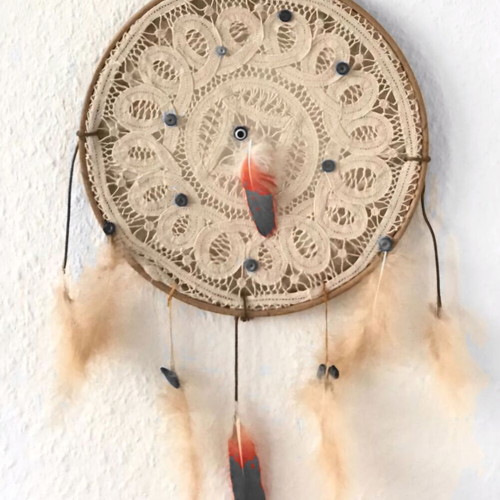Handmade dreamcatcher with lace, beads and feathers