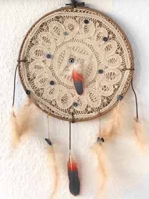 Handmade dreamcatcher with lace, beads and feathers