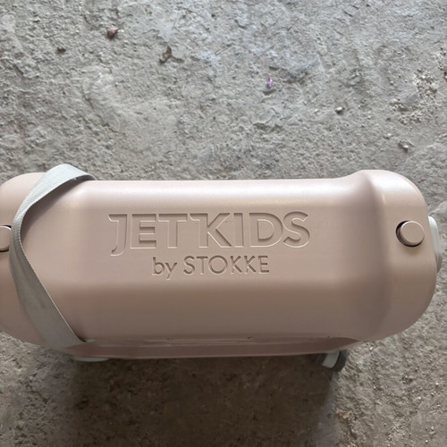 Stokke pink suitcase used with broken wheel part