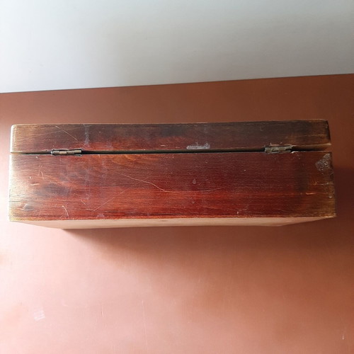 Wooden jewelry box used with carved decorations and red lining