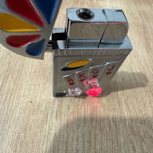 Playing card lighter used with red and yellow lights