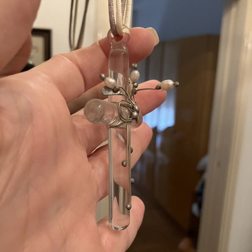 Decorative cross used with silver and pearls
